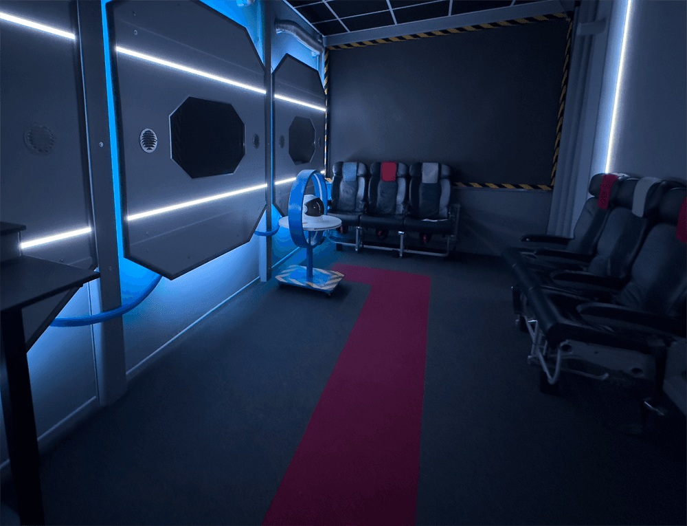 Futuristic cockpit-like corner of the studio with ambient lighting